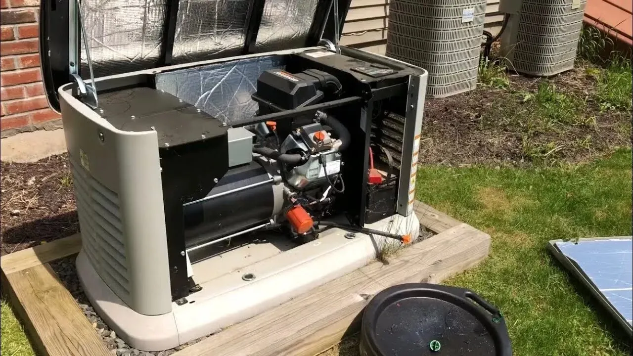 Home standby generator with its cover open for service, set on a pad beside the house